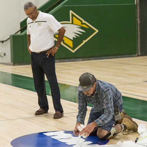 Blue NCAA logo added to court floor